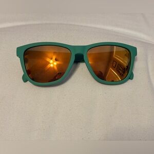 Stylish Green Sunglasses with Orange Lenses